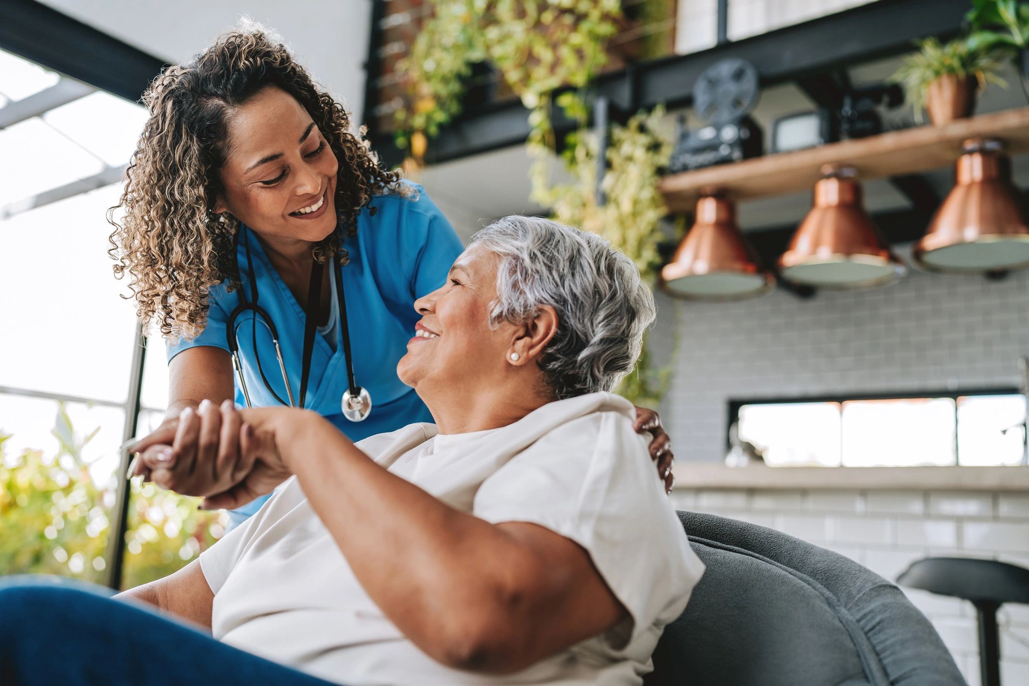 doctor providing house call to patient at home
